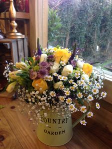 Beautiful Spring Flowers in a Country Jug